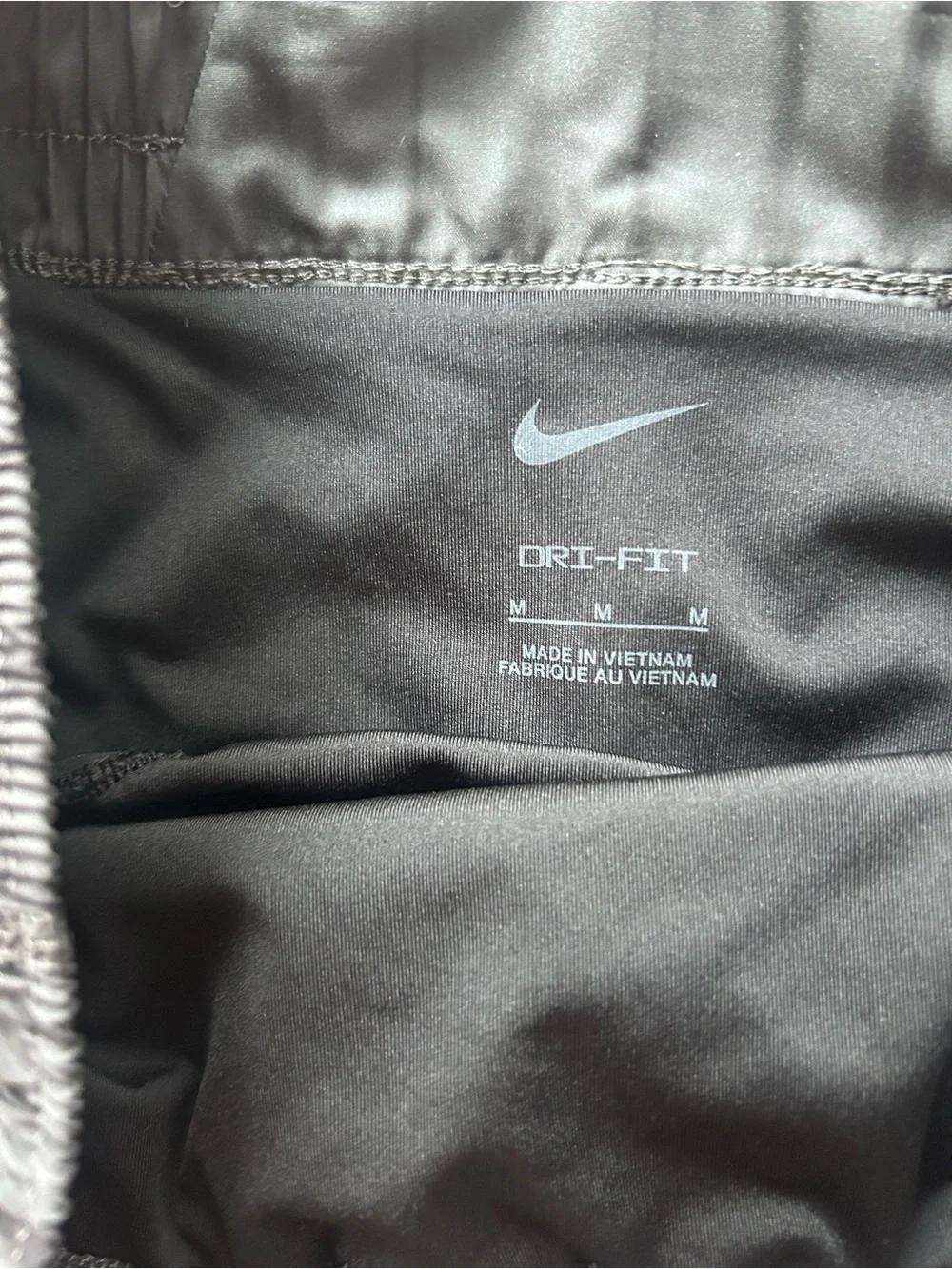 Nike Women's Dark Charcoal Athletic Shorts with Subtle Stripe size M